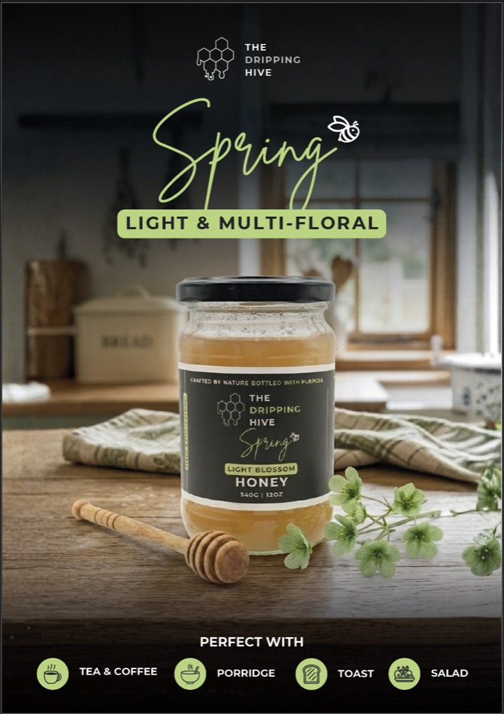 Spring honey jar poster in a kitchen with a wooden dipper and green hellebore blossoms